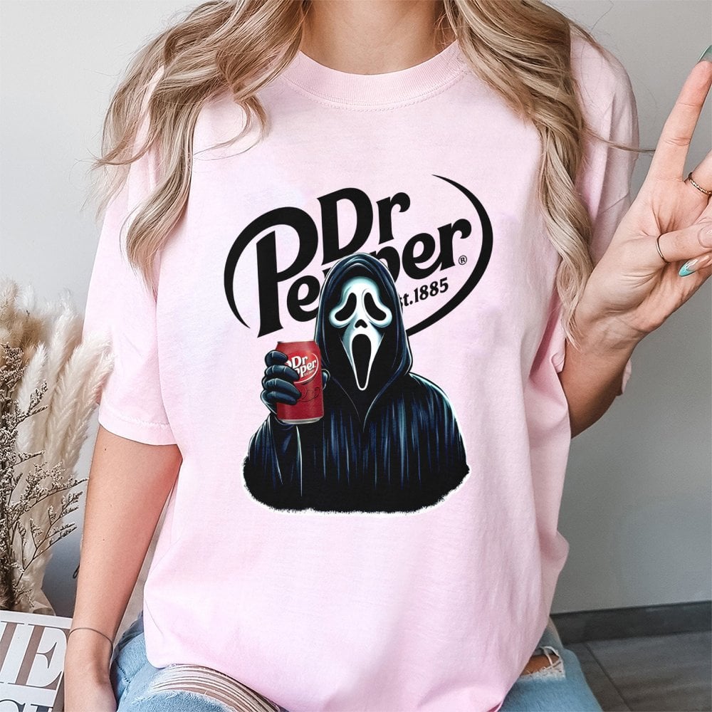 Horror Movie Ghost Graphic T-Shirt | Scary Slasher Drinking Soda Design | Premium Soft Cotton Tee | Unisex Halloween Gift for