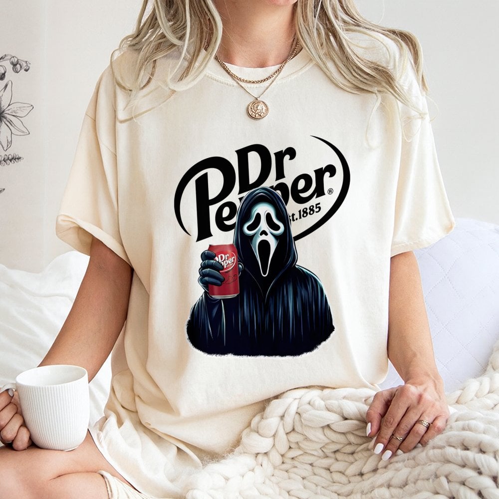 Horror Movie Ghost Graphic T-Shirt | Scary Slasher Drinking Soda Design | Premium Soft Cotton Tee | Unisex Halloween Gift for